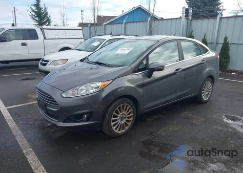 2014 Ford Fiesta Titanium z USA, uszkodzony, nr VIN 3FADP4CJ5EM220639